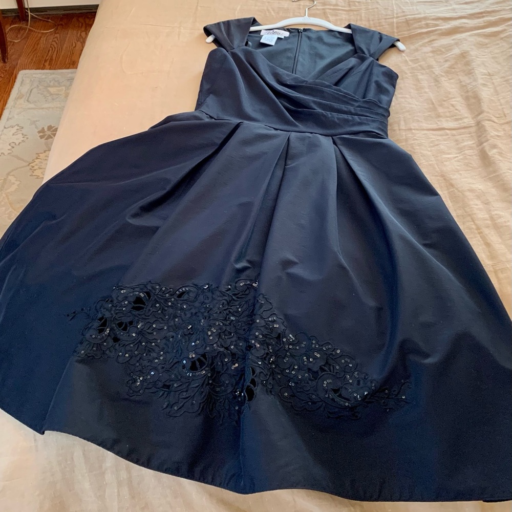 Black cocktail dress with sequin trim